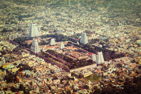 Vintage retro hipster style travel scene of Hindu temple and indian city aerial view with grunge texture overlaid. Arulmigu Arunachaleswarar Temple, Tiruvannamalai, Tamil Nadu, India