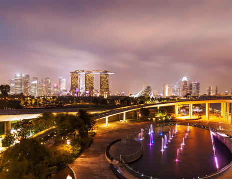 A travel background of Singapore skyline illumintaed in the evening twilight