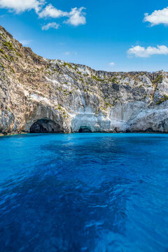 White coastal cliffs crystal clear turquoise sea blue sky. Striking Mediterranean seascape travel nature design. Breathtaking rocky coast scenic wallpaper. Beautiful nature background copy space