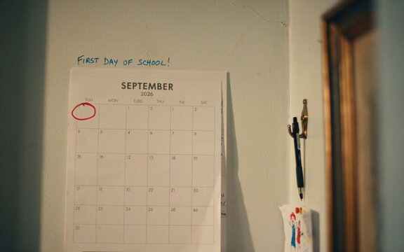 September calendar marked for back to school. Important date circled on a wall planner.