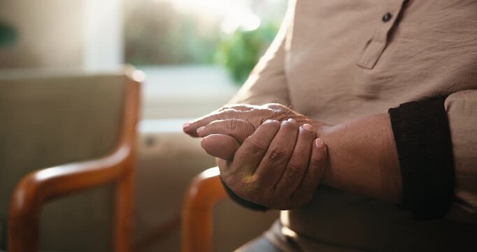 Arthritis, old woman or hands in clinic with massage, joint tension or discomfort in muscle pain. Retirement, tendinitis and senior person with ache, chronic condition and osteoporosis in hospital.