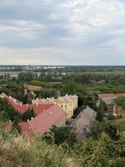 Obraz premium City Panorama Red Roofs River Trees Aerial View