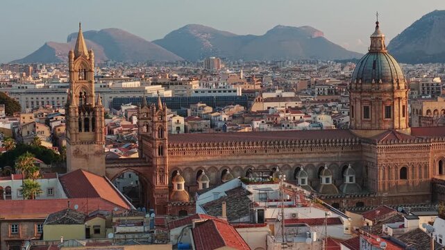Aerial view of Palermo Cathedral at sunrise, historic architecture of capital city in Sicily, Italy. Panoramic view of old town architecture in Palermo, stunning aerial shot of Sicilian capital at daw