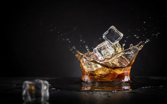 Pure vodka liquid, Refreshing Beverages & Dynamic Liquid Action, Cold refreshing beverage splashing over ice cubes on dark background
