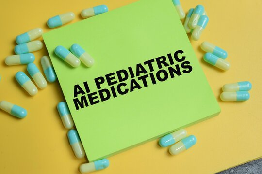Concept of AI pediatric medications write on sticky notes isolated on Wooden Table.