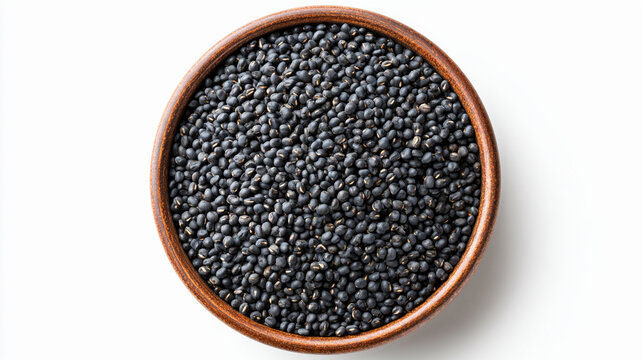 Top view of a wooden bowl filled with black urad dal isolated on white background