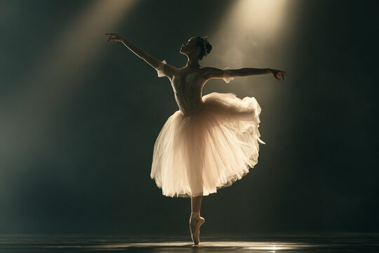 Elegant professional ballerina performing a graceful dance on stage under dramatic spotlight, capturing a mood of artistic dedication and perfection for performing arts marketing and inspiration.
