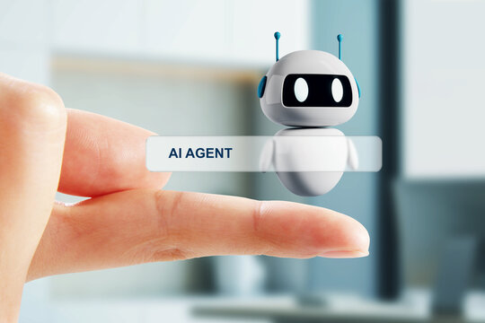 Hand holding digital AI agent label with small robot illustration in modern office setting