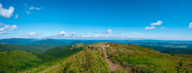 Panorama of the mountains with hiking trail and blue sky during summer. Bieszczady Mountains, Bukowe Berdo. © Tomasz