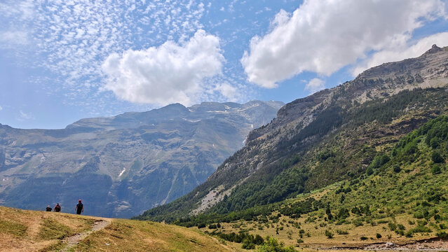 Panoramic view of hikers in Llanos de La Larri valley at Ordesa National Park.