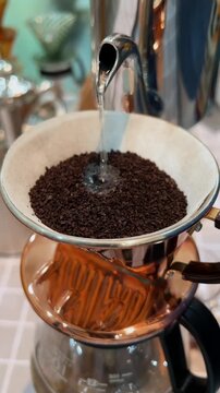 Hand Drip Coffee Brewing Over Fresh Coffee Grounds