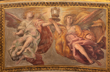 Obraz premium Crema - The baroque fresco of angels with the reliquiary in the church Chiesa di San Benedetto by Gian Giacomo Barbelli from year 1636.