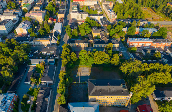 Aerial photo of a city H&auml;meenlinna in Finland with modern apartment buildings between trees, living in nature. 