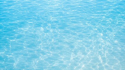Fototapeta premium Fresh background of a pale blue pool water surface sparkling in