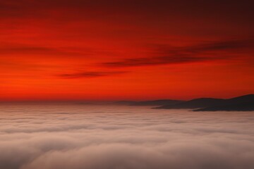 Obraz premium Deep red hues dominate the upper sky while a thick blanket of pale cloud fills the lower half, subtly recalling the simplicity of the Indonesian flag.