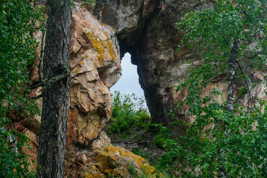 Natural stone arch among cliffs on the Path of Ancestors
