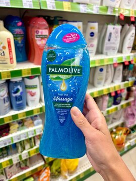 01.08.2026 Ukraine, Kharkov Woman Holding Palmolive Shower Gel Bottle in Supermarket