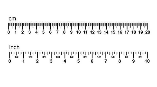 Black and white measuring rulers showing centimeters and inches on a clean white background surface