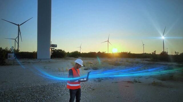 Engineer with laptop receives IoT data from wind turbines for smart grid monitoring and renewable energy management. 3D render