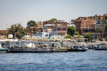 Obraz premium Tourist boats moored by the boat launch for the Philae temple complex in Aswan, Egypt