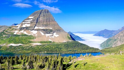 Majestic mountain landscape in Glacier National Park, Montana, featuring rugged peaks, natural rock formations, and the untouched beauty of the Rocky Mountains. © Fern