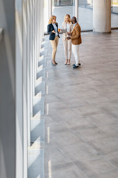 Business team discussing ideas in modern office space during daytime