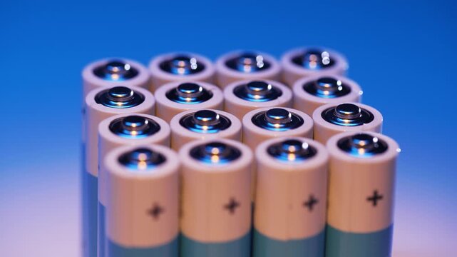 Several batteries neatly stacked in a vertical column