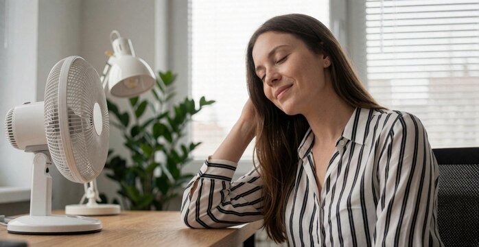 Relaxing Woman with Fan at Home Serene Indoor Comfort Lifestyle
