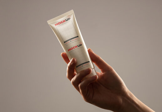 Hand Holding Cosmetic Tube Premium Mockup