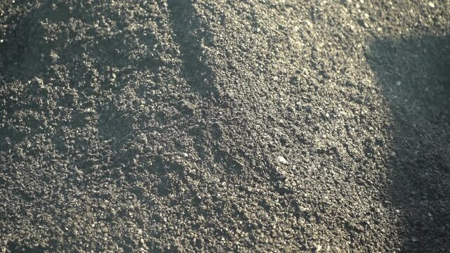 Hot Asphalt Mix During Road Paving in Close-Up