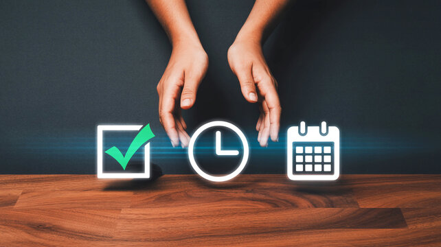 Professional top-down view of hands interacting with digital icons for time management, scheduling, and task completion on a wooden desk