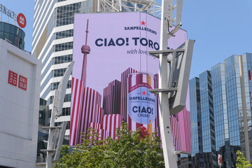 Fototapeta premium digital billboard at Sankofa Square featuring ad for Sanpellegrino CIAO! cherry flavored sparkling water, Toronto