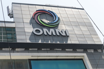 Fototapeta premium OMNI television (Rogers Communications) logo on the outside of 33 Dundas St E, a former studio, near Sankofa Square, Toronto