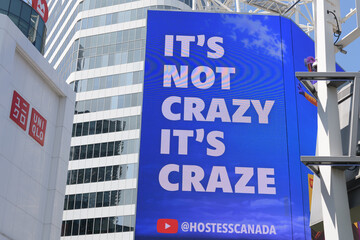 Fototapeta premium text advertising copy of Craze line of snack cakes by Hostess Canada, on display at Sankofa Square, Toronto
