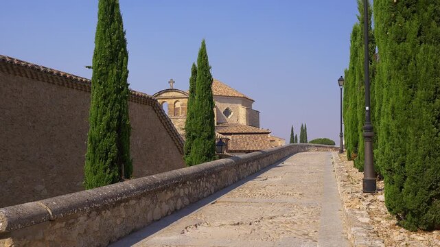 Cypress lined stone path by San Pablo Convent church in historic Cuenca, Castilla La Mancha