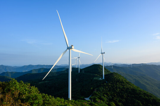 Wind Turbines on Forested Mountain Ridge