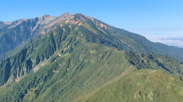 Kurobe Gorge, the ridgeline extending from Mt. Yakushi, and Mt. Etchuzawa as viewed from the summit of Mt. Sugo-no-zuko in Toyama City, Toyama Prefecture, Japan in September.