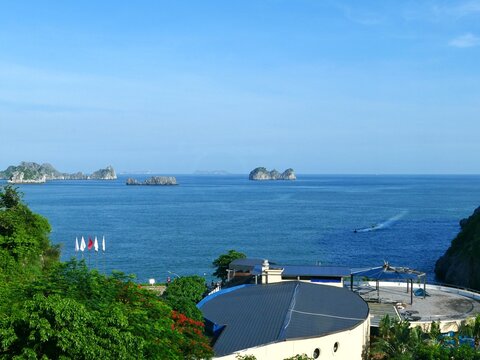 Lan Ha Bay, Haiphong City, Vietnam. The bay is recognized by UNESCO as a natural world heritage site, with limestone mountains formed millions of years ago, and vegetation, surrounding a bay in a trop