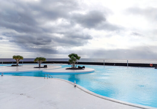 Arrecife, Lanzarote, Spain - December 17, 2025: General view of the saltwater pool at Islote de Fermina, an iconic seaside complex designed by Cesar Manrique in the capital of Lanzarote