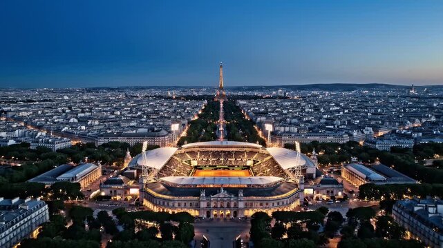 Aerial view of the Eiffel Tower and Paris cityscape at dusk.