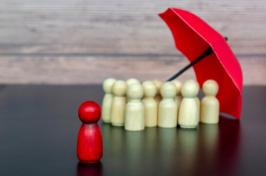 Leadership figure surrounded by followers under umbrella representing trust, security, and collective protection.