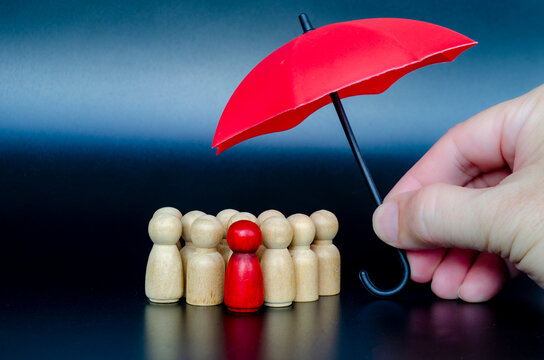 Central leader protected by umbrella symbolizing responsibility, security, and confidence in uncertain situations.