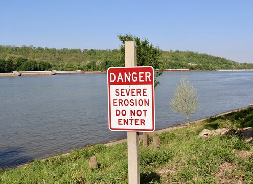 A close view of the red and white danger sign.