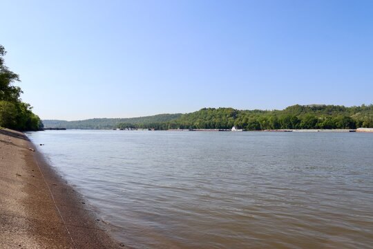 The peaceful flowing river in the countryside.