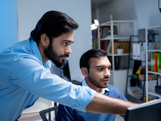 Fototapeta premium Team engineers software developers are brainstorming and using computer writing code to develop AI technology. Programmer using laptop work system about artificial intelligence and cyber security 