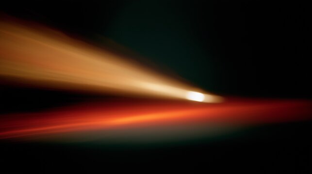 Abstract Orange Red Light Streak Dynamic Motion Blur Glow featuring vibrant luminous waves of warm light moving diagonally across a deep black background. 