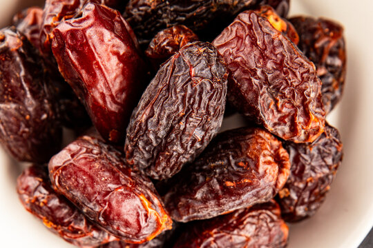 Dates sweet dessert edible fruits of the date palm food preparation tasty snack fresh and delicious gourmet food background on the table rustic food top view copy space keto and paleo diets vegetarian