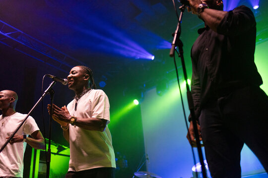 African american singers performing live music on stage
