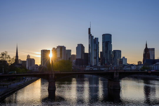 Frankfurt on Main, Germany, a view of the financial district from the Main river at golden hour in the evening