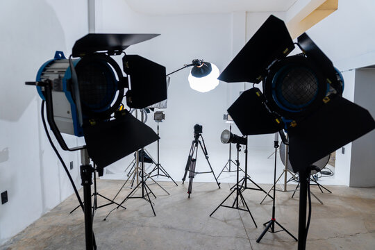 Studio Setup With Lights and Camera for a Shoot in a Plain Room